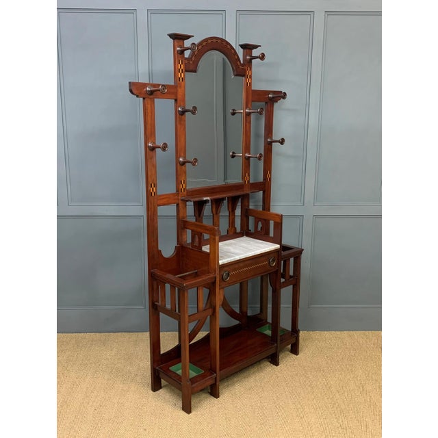 A splendid hall stand from the Arts and Crafts period. Of excellent construction in solid mahogany and of generous...