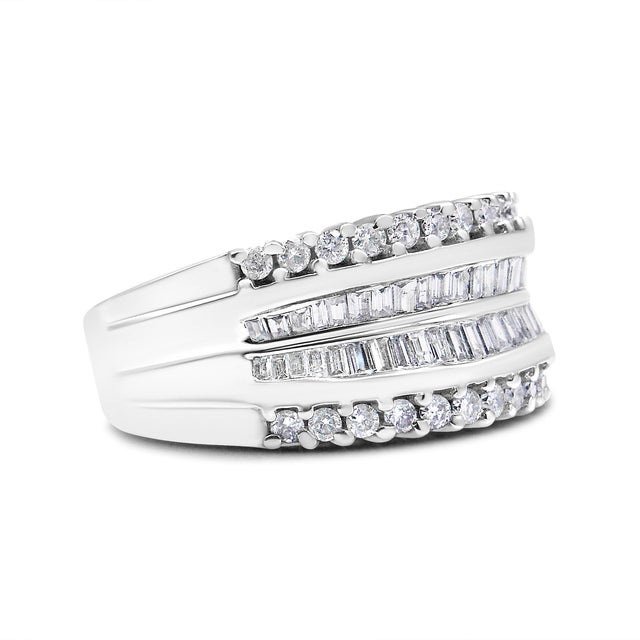 Modern and elegant, this stunning diamond ring has an impressive total diamond weight of 1.00 c.t. This beautiful band is...