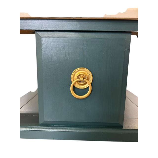 A beautifully refinished vintage console table featuring a luxurious white marble top over a rich deep teal painted base....