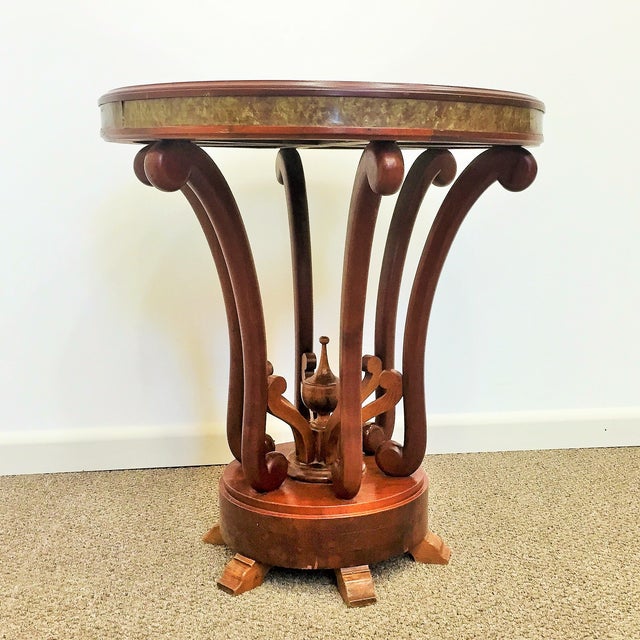 Coffee table in mahogany with machined in the center. Ideal auxiliary table. Intricate design features.
