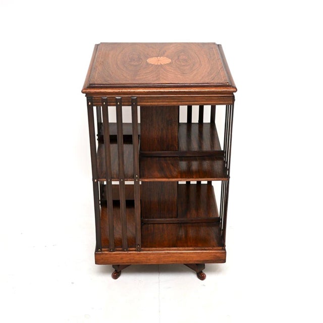 An outstanding antique Edwardian inlaid revolving bookcase. This was made in England, it dates from around the 1900-1910...