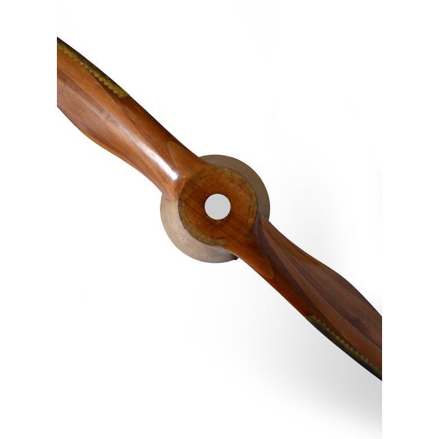 An original Caproni wooden aircraft propeller dating from the 1930s, preserved with its characteristic laminated-wood...