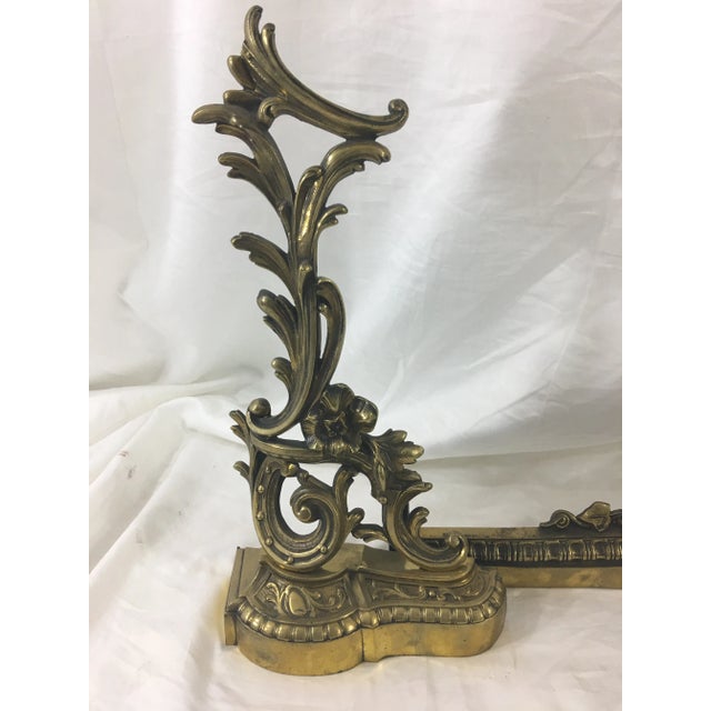 This lovely three-piece bronze andiron set is decorated with flowers and flourishes, making it exceedingly elegant. Dates...
