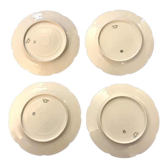 Early 20th Century Limoges Porcelain “Old Abbey” dinner plates. Set of 4. A beautiful set of 4 hand painted, scalloped and...