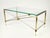 This elegant coffee table features a timeless Neoclassical silhouette that effortlessly blends historical charm with 1960s...