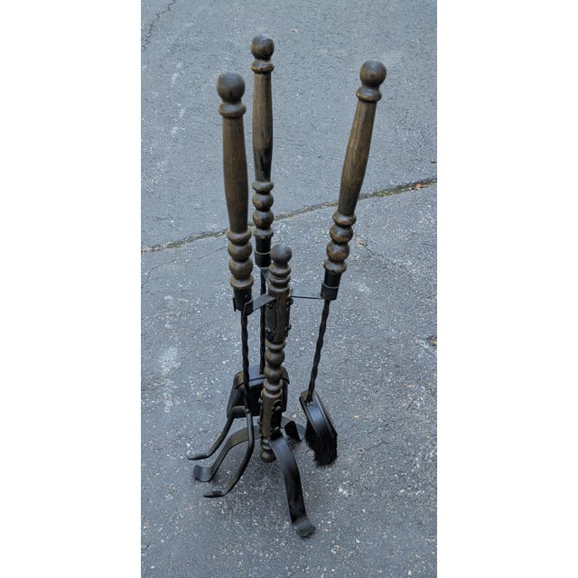Elevate your hearth with this exceptional 1950s vintage cast iron fireplace tools set, a striking example of mid-century...