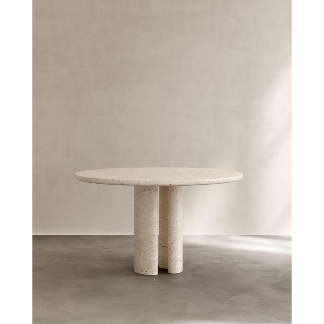 Roman dining table iii in navona travertine by paloma editions dimensions: d 160 x w 160 x h 75 cm. Materials: travertine....