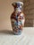 Japanese Imari porcelain vase in classic baluster form with a flared rim. Hand-painted. Dates to the late 19th century...