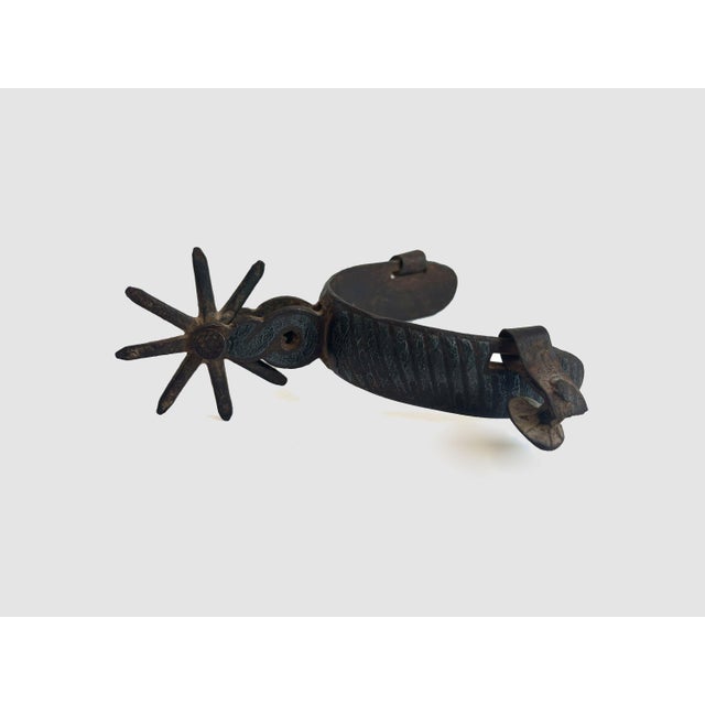 Kick up the western vibes in your décor with this single antique western charro cowboy spur. · 5.5” long x 3” wide x 2”...