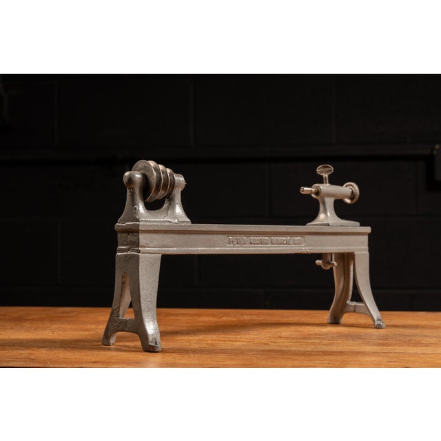 c. 1900s; Peter Austin - Muncie, IN Antique cast iron tabletop manual training lathe with steel hardware. This piece was...