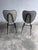 The chairs feature Hitier’s characteristic use of a slender black tubular steel frame, combined with softly upholstered...