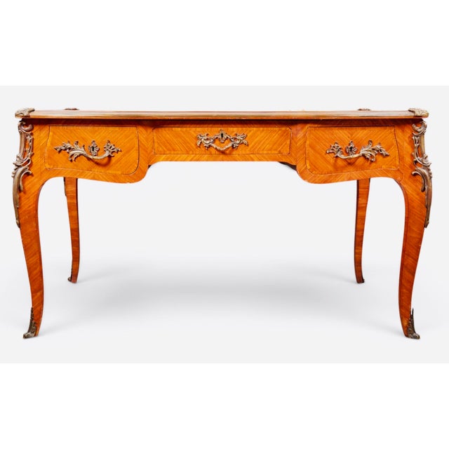 French Louis XV Parquetry & Gilt-Bronze Leather-Top Bureau Plat, circa 1900 An elegant French Louis XV Revival bureau plat...
