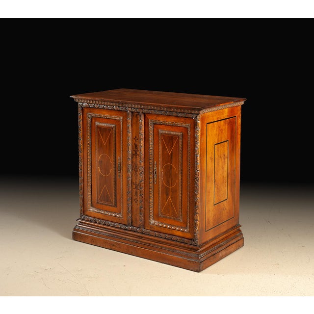 Handcrafted in Italy from walnut, this two-door credenza combines elegant proportions with detailed decorative...