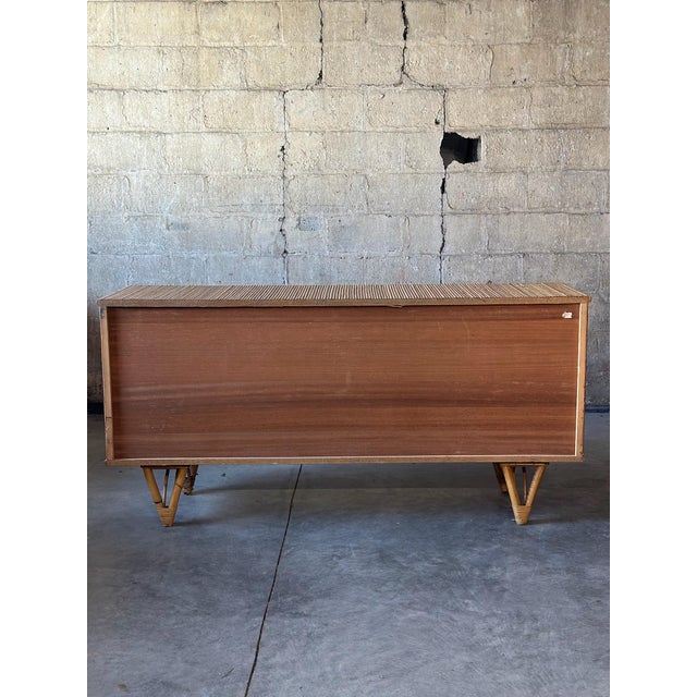 A spectacular piece by Andoux & Minet. Bamboo, wood and wrought iron. Beautiful construction and a classic shape.