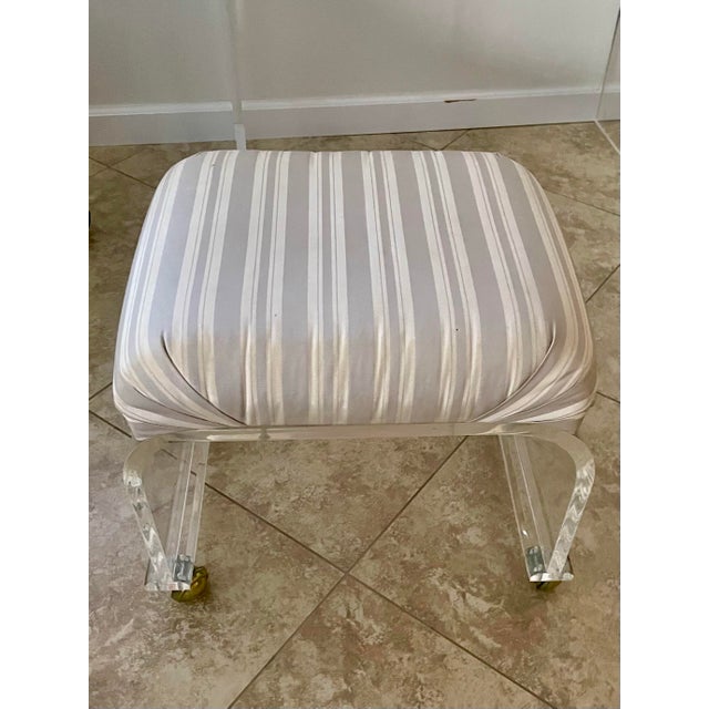 Vintage Mid Century Modern Lucite waterfall stool by Charles Hollis Jones featuring a thick clear Lucite base with rounded...