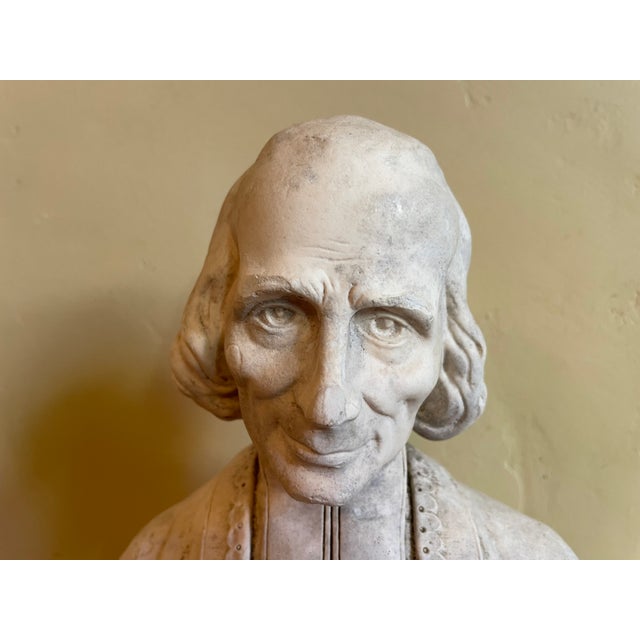 The holy statue (1900) of Jean Baptiste Marie Vianney (1786-1859) who lived in Ars sur Formans. Vianney was canonized in...