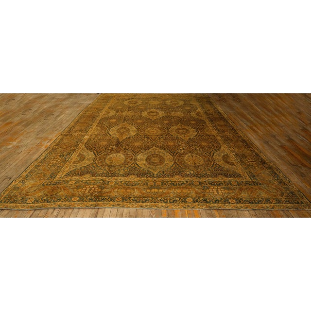 A magnificent and museum-quality Antique Persian Silk Kerman carpet, circa 1840. Measuring a commanding 10' 4" x 15' 5",...