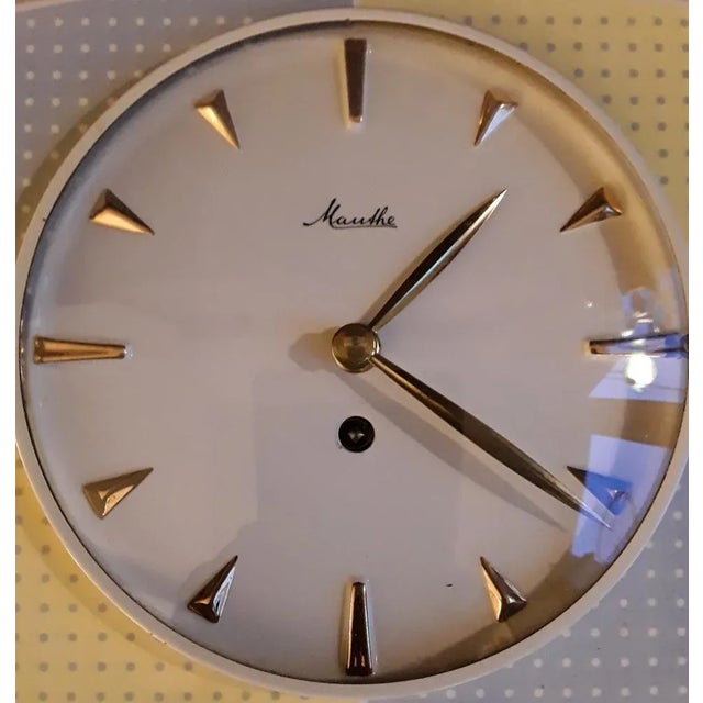 Mid-Century German Machanical Wall Club Clock in Cream-Colored Ceramic with Yellow-Blue Decor from Mauthe, 1950s, in Very...