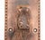 Antique door pull made of copper finish cast iron with an ornate Victorian design and a lock insert. The original mounting...