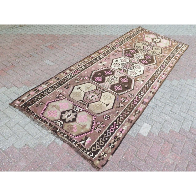 This beautiful, traditional vintage, flat weaved Turkish kilim rug is approximately 80 years old. It is handmade of very...