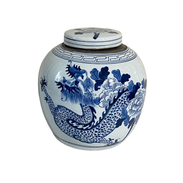 This 12" H by 11.5" Diameter Chinoiserie ginger jar features stunning hand-painted blue and white porcelain with intricate...