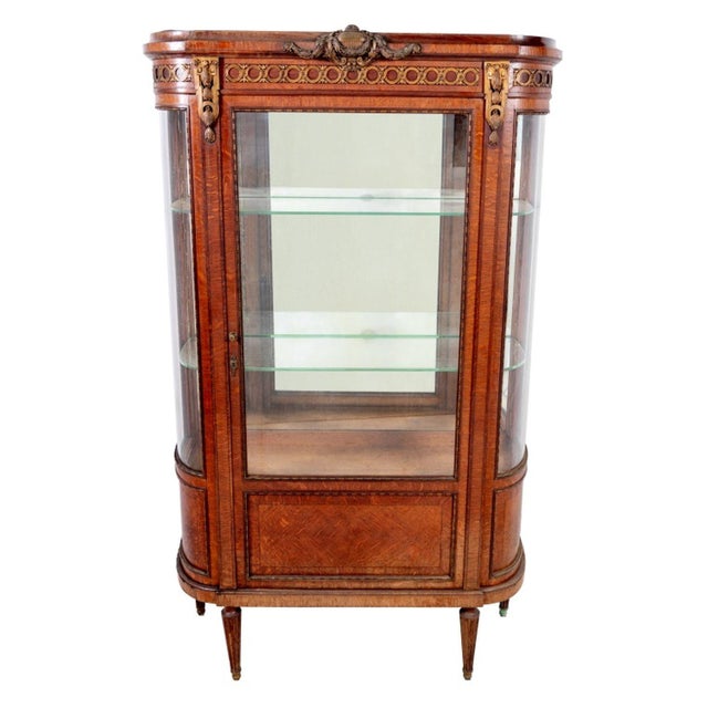 Louis XVI Style Gilt Metal Mounted Oak Vitrine, 20th century, the glazed door enclosing three shelves. 67" H x 39" W x 15" D.