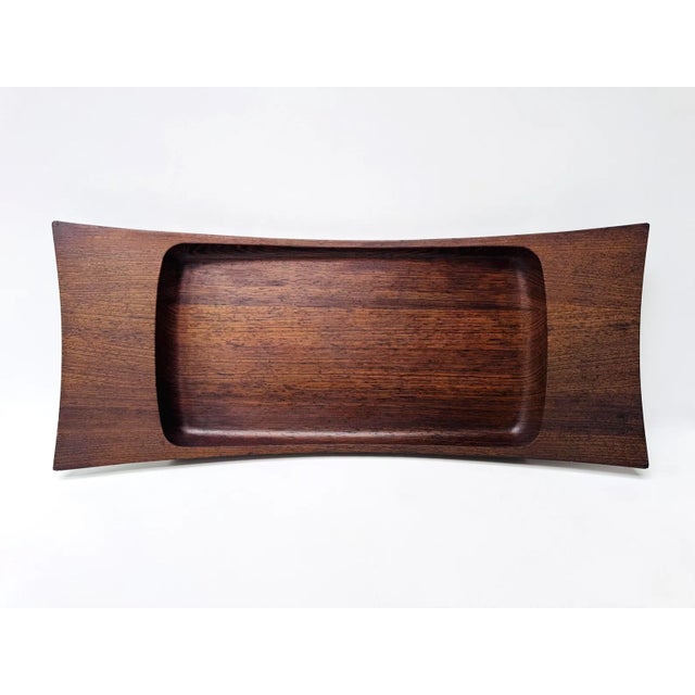 This beautiful Dansk serving tray was designed by Jens Quistgaard and bears the faint but legible stamp on the underside....