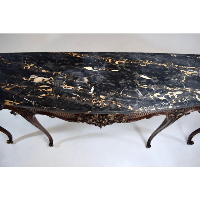 Superb, monumental early 20th C. Louis XV style console table with original imported fitted Portoro marble slab top....