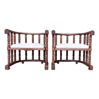 Early 20th Century Pair of Spanish Slatted Barrel Back Hand Carved Chairs For Sale