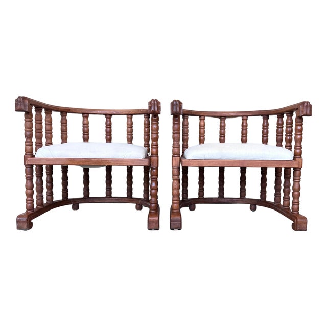 Early 20th Century Pair of Spanish Slatted Barrel Back Hand Carved Chairs For Sale