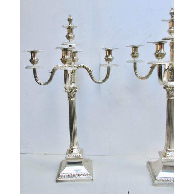 English, a late 19th-century pair of grand candelabra. (25" tall). Georgian style and grand scale, each has 5 candle arms,...