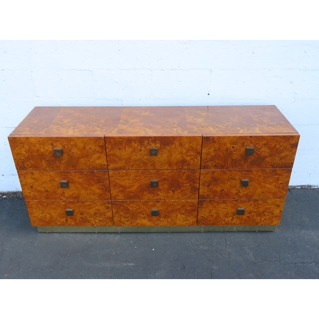 This magnificent Dresser is made of wood, solid wood, burlwood, veneer, and metal. We believe it was made by the Founder...