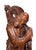 A finely carved Late Qing Dynasty (Late 19th Century) Chinese rosewood figure depicting a Luohan (Arhat), accompanied at...