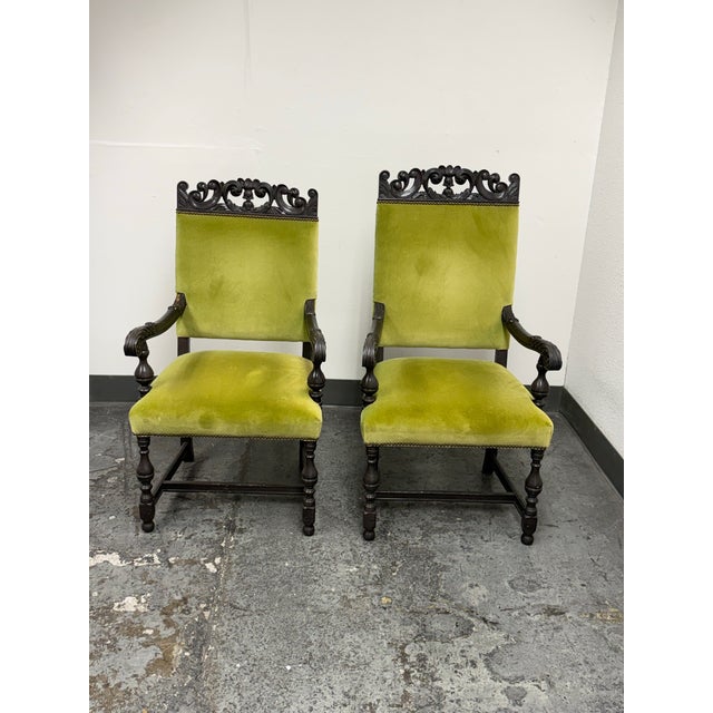Design Plus Gallery presents a Pair of Antique Couples Armchairs. The coordinating chairs are crafted in two different...