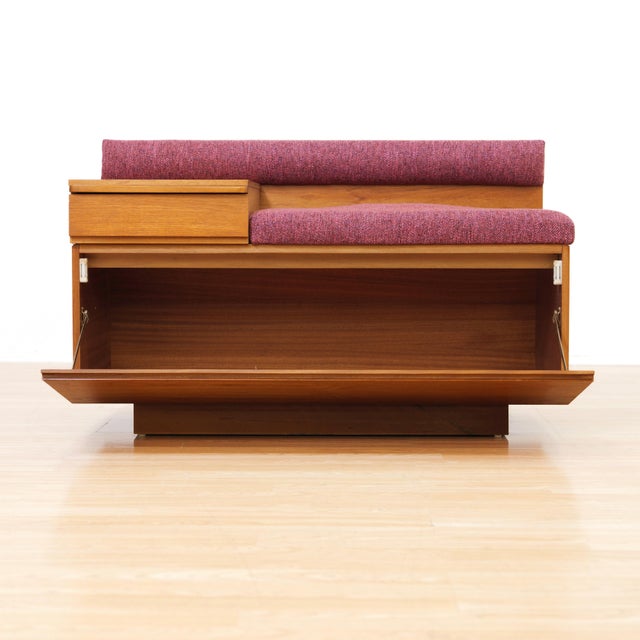 This vintage entryway bench was designed and manufactured in England by 'Chippy Heath' during the 1960s. With a wonderful...