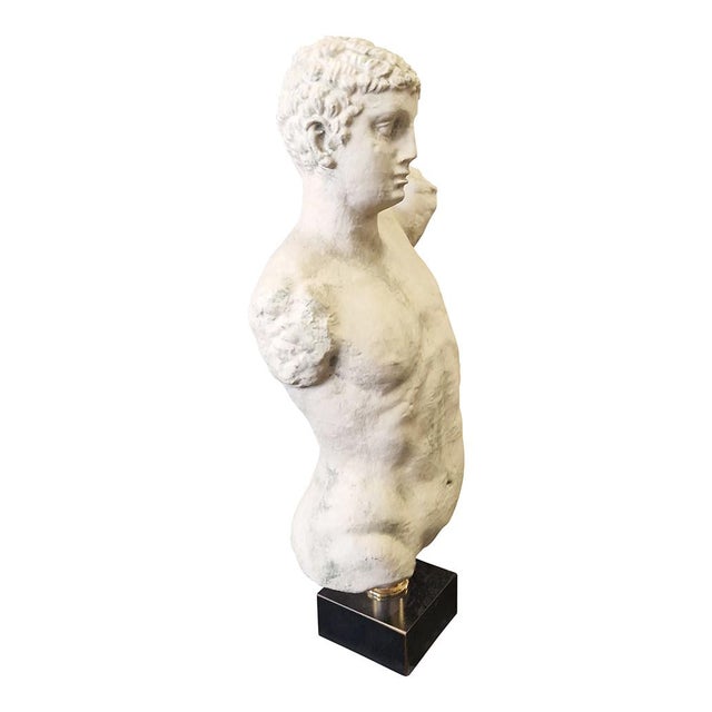 Classical style bust in plaster, on a marble base and cylindrical support in chrome-gold metal. Dimensions (LxDxH) cm 42 x...