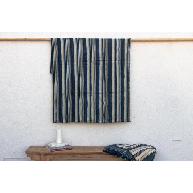 Hand-woven by master weavers of the Mossi and Dioula traditions in Burkina Faso, West Africa, these vintage textiles are...