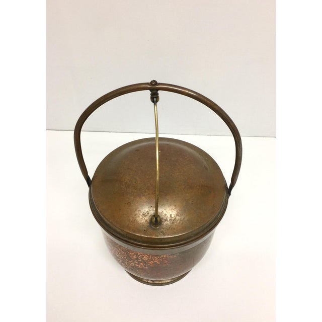Antique copper ice bucket with hinged lid. Manufactured by The Poole Silver Company in Massachusetts. This copper ice...