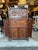 A very sophisticated, heavily hand carved Asian style dry bar , liquor cabinet featuring two central front doors, and 4...
