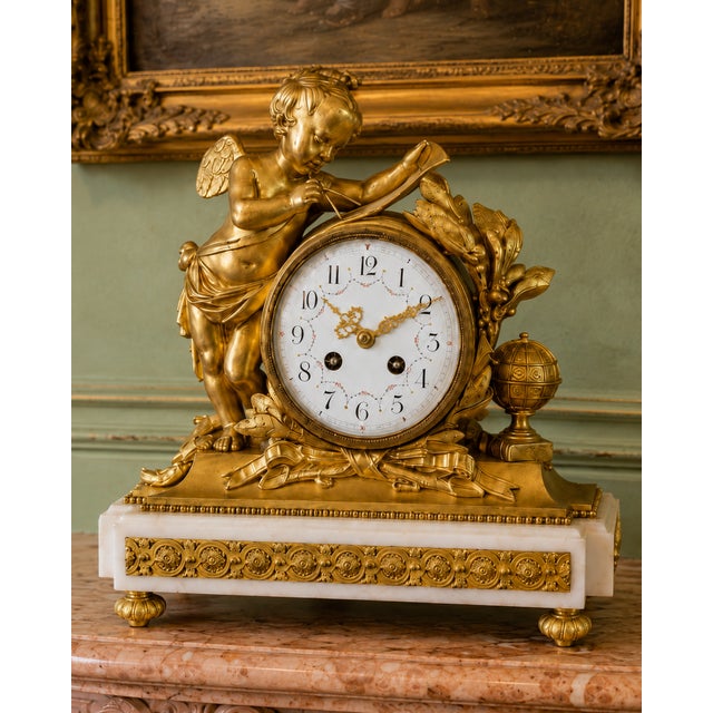 A magnificent 19th-century French Louis XVI-style clock set, crafted in richly detailed ormolu bronze and marble. This...
