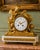A magnificent 19th-century French Louis XVI-style clock set, crafted in richly detailed ormolu bronze and marble. This...