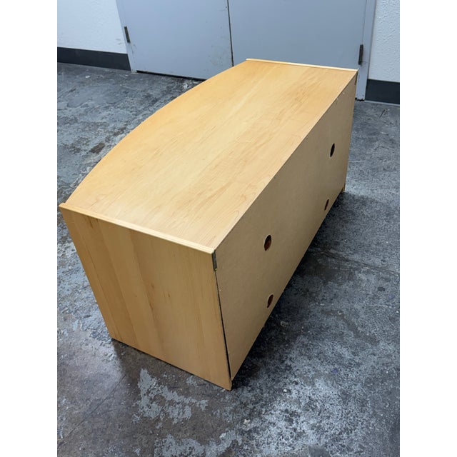 Design Plus Gallery presents a Media Cabinet with a Maple Wood Veneer. The piece has a post modern and European design...