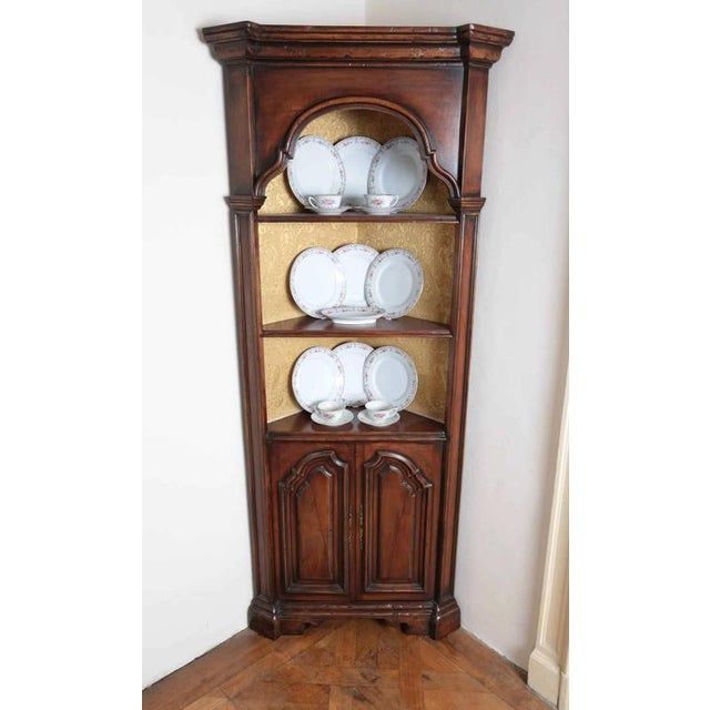 Beautiful corner cabinets in Renaissance style with open shelves. In the upper part there are display cases upholstered in...
