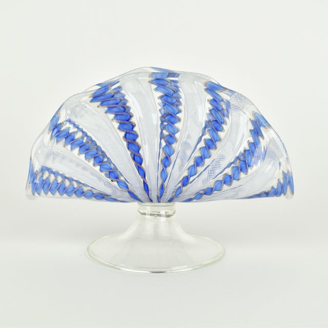 Rare mid century Murano glass napkin holder. The glass shows cornflower blue, glittering copper color and white latticino...
