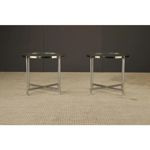This refined pair of round side tables showcases the kind of restrained elegance and architectural clarity associated with...