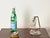 Gorgeous and unique adjustable table lamp crafted in a stunning combination of murano mouth-blown glass and brass. This...