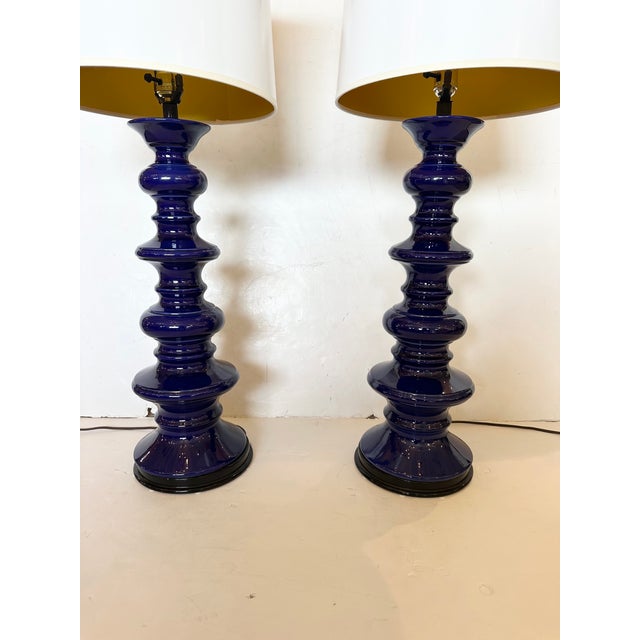 Pair of impressive tall Italian blue ceramic table lamps having undulating stacked sculptural round forms. Shades not...