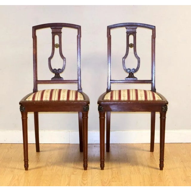 We are delighted to offer for sale this gorgeous pair of antique occasional chairs with fabric seats. This pair of chairs...