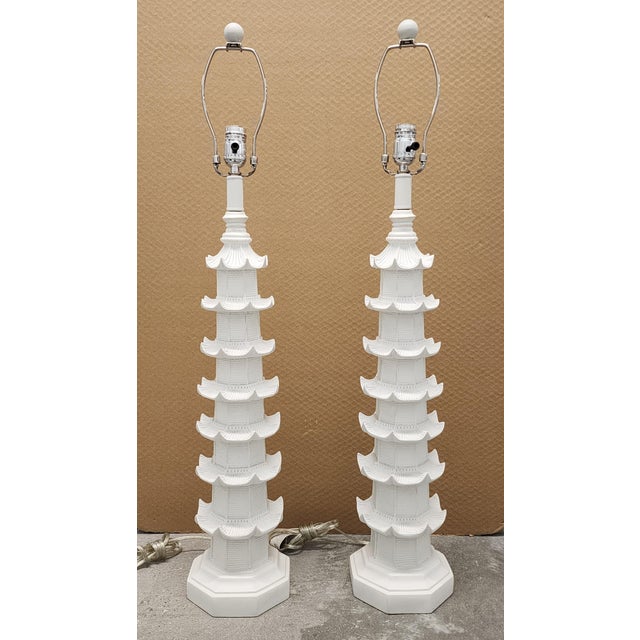 Striking pair of tall Chinoiserie style white Pagoda table lamps. Well designed and very nicely detailed, they are quite...