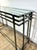 Smoked silver metal console table with a glass top, circa 1990s/2000s. Contemporary design that complements any style....